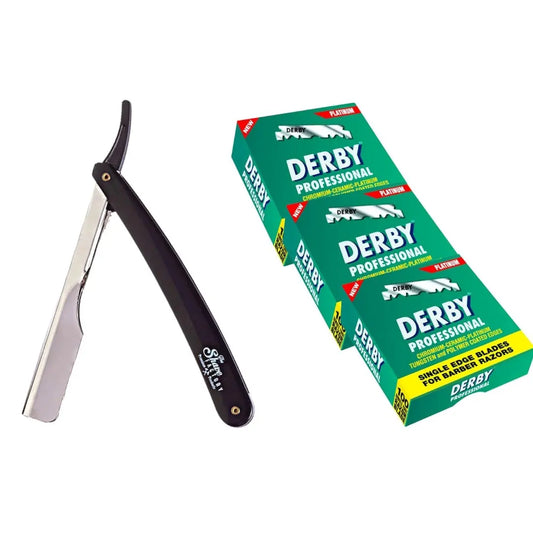 Shaving razor with black handle and silver blade next to a green box of Derby razor blades on a white background