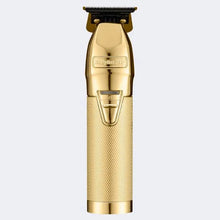 BabylissPro Gold hair clipper on a light gray background
